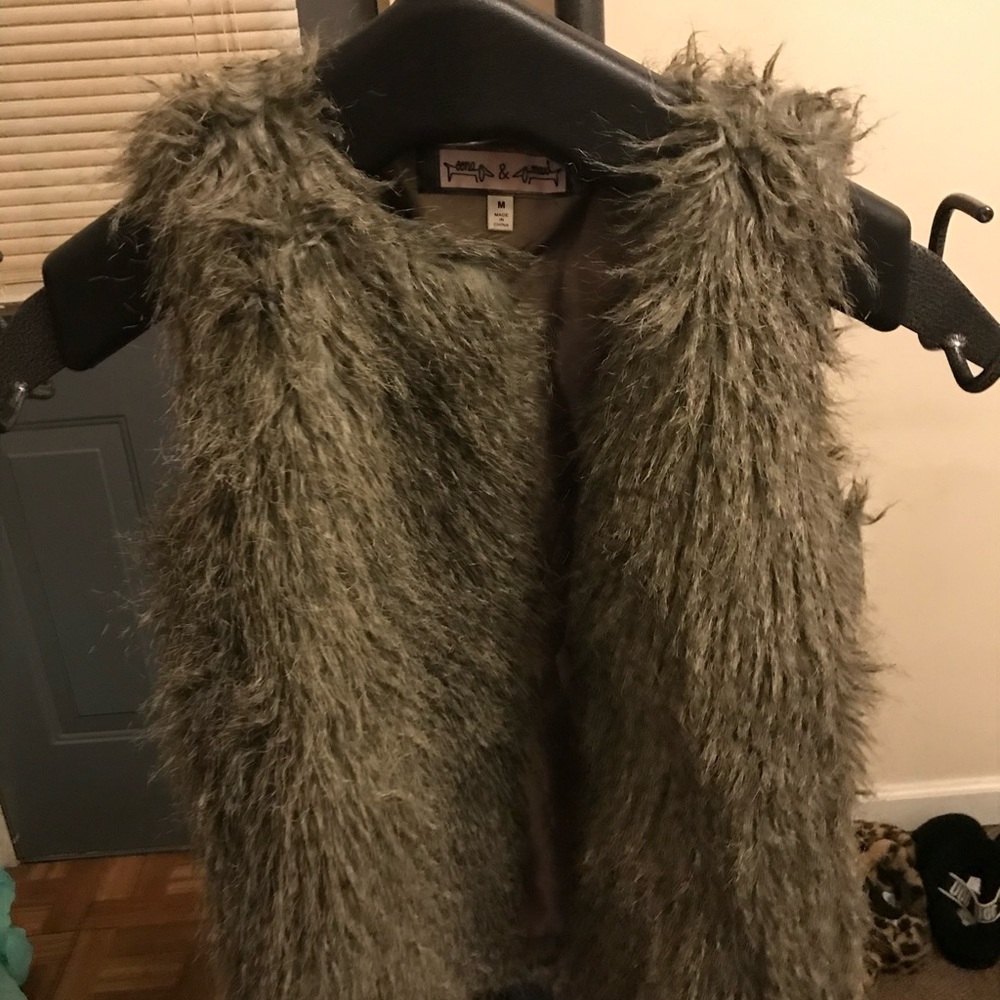 Gray fuzzy vest.